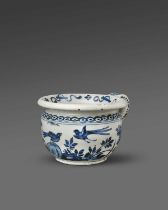 A rare delftware vomit pot, c.1700, probably London, painted in blue with long-tailed birds in