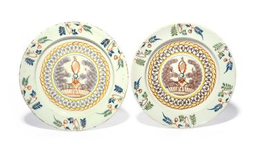 A near pair of London delftware chargers, c.1740, William Griffith, decorated with a rare design