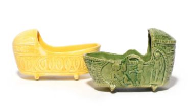 Two Staffordshire pearlware models of cradles, 19th century, one green-glazed and moulded with putti