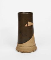 Eileen Lewenstein (1905-2005) a stoneware cylindrical vase, resist decorated with an ochre glaze,
