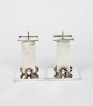 Jean Després (1889-1980) a pair of Modernist silver plated candlesticks, square section stem with