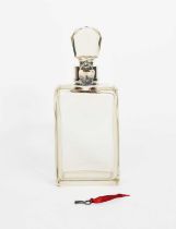 A silver mounted lockable glass decanter by Hukin & Heath Ltd, shouldered rectangular decanter