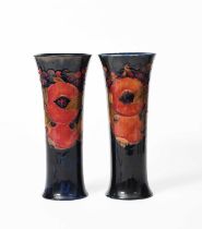 'Pomegranate' a pair of Moorcroft Pottery vases designed by William Moorcroft, waisted,