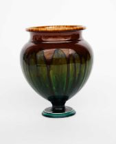 A Linthorpe Pottery urn vase designed by Dr Christopher Dresser, model no.433, covered in a streaked
