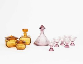An Art Deco amethyst glass decanter and six glasses, the decanter and stopper tapering facetted form