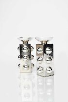 Jean Després (1889-1980) A pair of Modernist silver plated candlesticks, square section with three