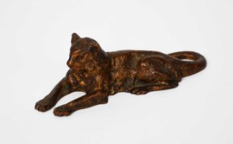 A Tiffany Studios patinated bronze Lioness paperweight, modelled lying stamped marks, 12.5cm. wide.