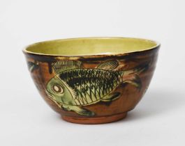 Henry Hammond (1914-1989) an earthenware footed bowl, painted with a frieze of large scaly fish
