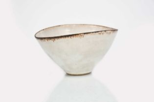 Φ Dame Lucie Rie DBE (1902-1995) a stoneware bowl, flaring elliptical form, covered to the foot with