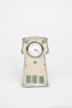 An Arts and Crafts Levi & Salaman silver and enamel easel back clock, the shaped, hammered silver