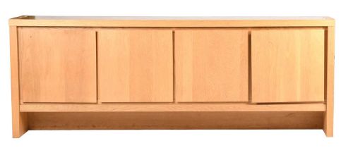 A Basix oak sideboard the design attributed to Karel Mintjens, rectangular with raised dovetail