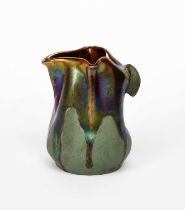 An unusual Art Nouveau pottery ewer probably Tiffany Studios, gourd, dimpled form with pinched
