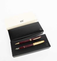 A Mont Blanc Meisterstuck fountain pen, red with gold-filled cap, in fitted case, and a Mont Blanc