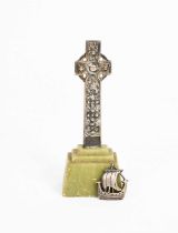 An Iona silver Celtic Cross designed by Alexander Ritchie, on stepped green stone base, and an