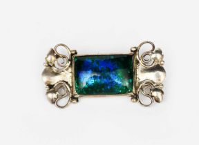 A silver and enamel brooch the design attributed to the Guild of Handicraft, rectangular form with