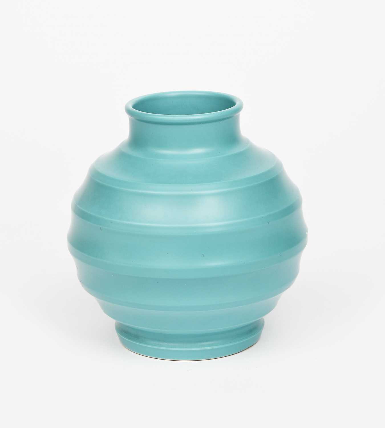A Wedgwood Pottery vase designed by Keith Murray, ribbed, ovoid form with collar rim, covered in a