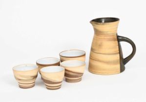 Gordon Baldwin (born 1932) an Agate jug and four tea bowls, striped agate to the exterior, the