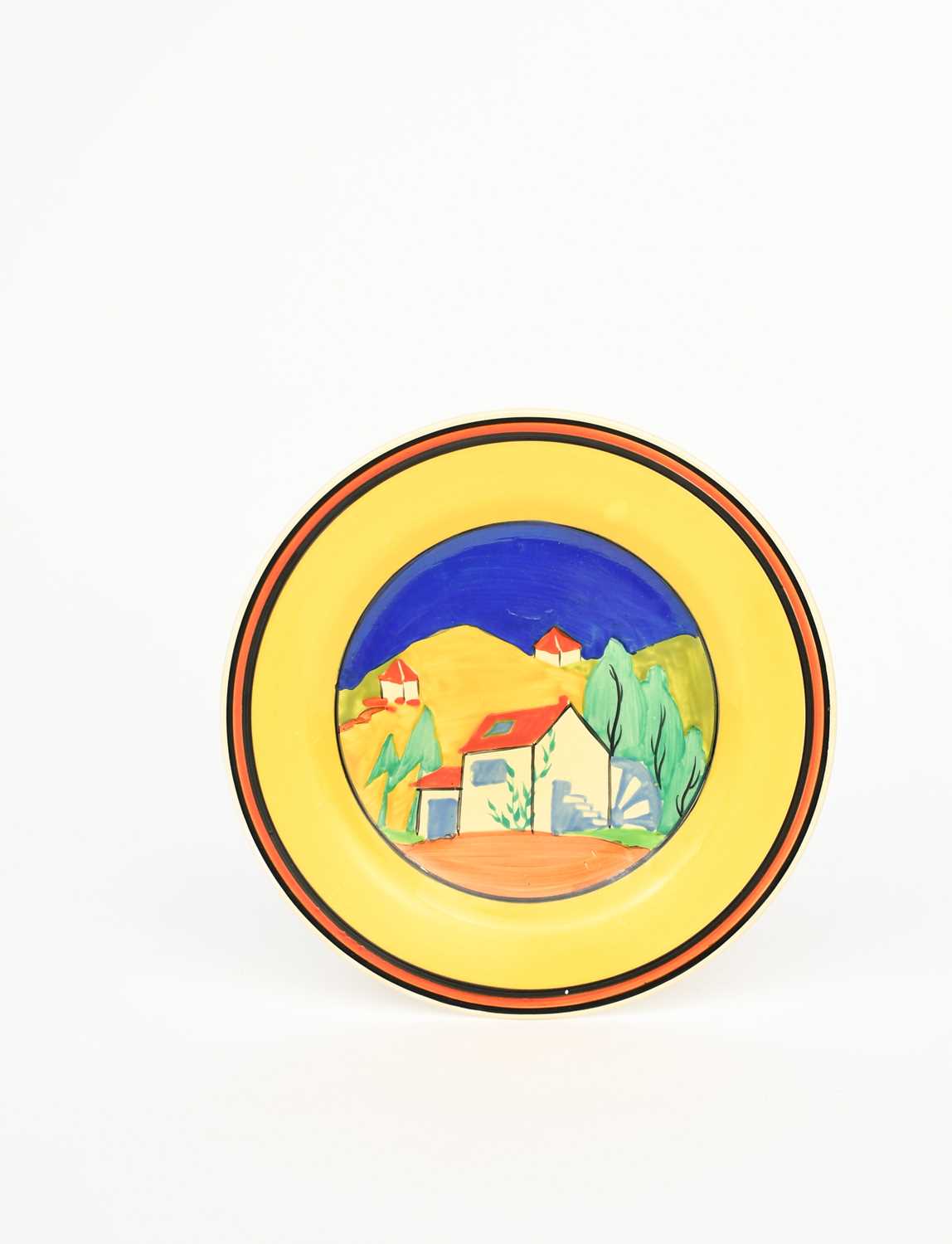 'Applique Lugano' a Clarice Cliff Bizarre plate, painted in colours inside yellow, red and black