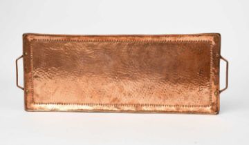 A John Pearson copper twin-handled tray, rounded rectangular section with hammered finish, applied