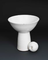 Φ Gordon Baldwin (born 1932) an earthenware stem cup with apple, covered in a white glaze