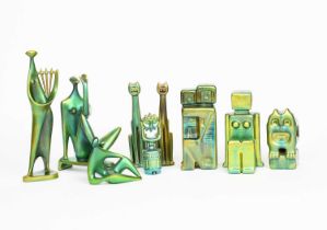 A pair of Zsolnay Pecs Cubist book ends, each modelled as seated figures, covered in a green