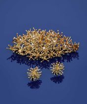 Φ David A Thomas (born 1938) a diamond set 18 carat gold Sputnik brooch and en suite stud