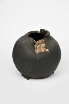 Φ Dan Kelly (born 1953) Ovoid Torn Vessel, on three feet, glazed matt black with white highlights,