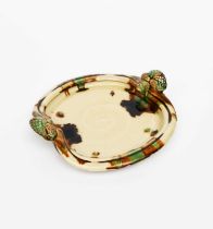 Takeshi Yasuda (born 1943) a stoneware twin-handled platter, covered in a Sancai glaze, impressed