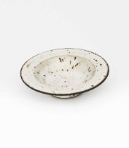 Φ Dame Lucie Rie DBE (1902-1995) a stoneware bowl, covered in a speckled silver-grey glaze impressed
