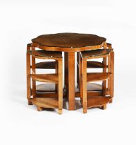 An Art Deco burr walnut nest of tables, shaped round section with four quarter tables, glass top,