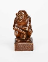 A pottery model of a seated monkey probably Dutch in the manner of Joseph Mendes Da Costa,