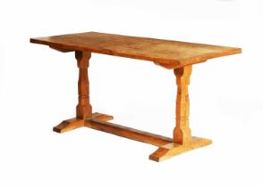 A Wilf Squirrelman Hutchinson oak dining table, rectangular, adzed top on two pedestals with