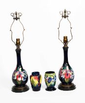 'Frilled and Slipper Orchids' a pair of Moorcroft Pottery table lamps designed by William Moorcroft,