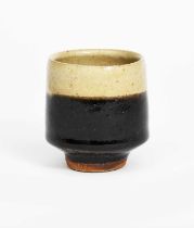 Atsuya Hamada (1932-1986) a stoneware unomi, footed, tapering cylindrical form, glazed ash to the