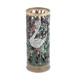 A PAINTED CAST IRON STICKSTAND EARLY 20TH CENTURY of pierced cylindrical form decorated with a stork