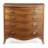 A REGENCY MAHOGANY BOWFRONT CHEST EARLY 19TH CENTURY fitted with a brushing slide above four long