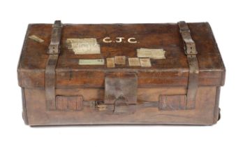 A BROWN LEATHER TRUNK LATE 19TH / EARLY 20TH CENTURY and marked with owners name 'C.J. Cole' and