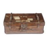 A BROWN LEATHER TRUNK LATE 19TH / EARLY 20TH CENTURY and marked with owners name 'C.J. Cole' and