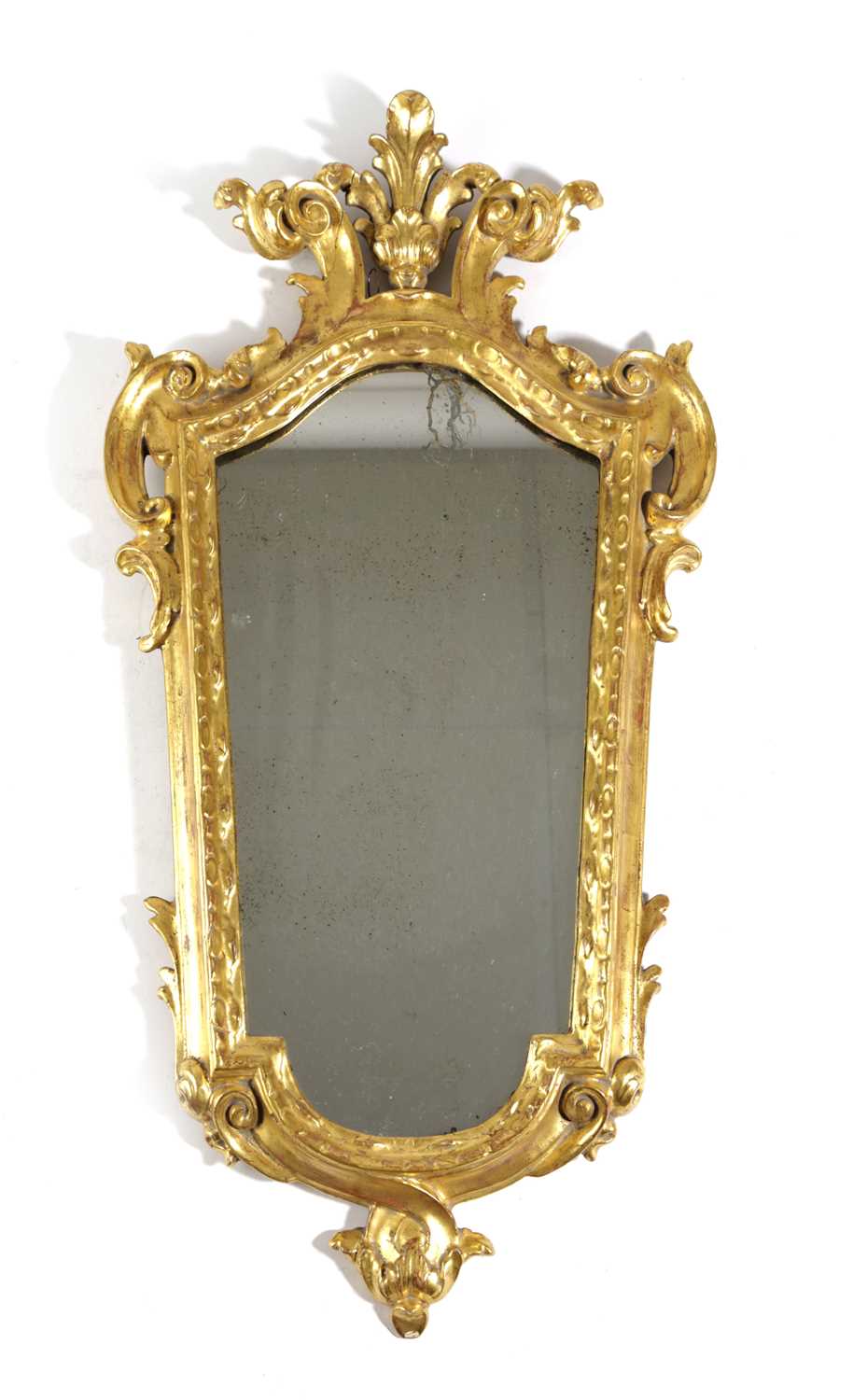 AN ITALIAN GILTWOOD WALL MIRROR FLORENTINE, 19TH CENTURY of tapering form, the later plate within