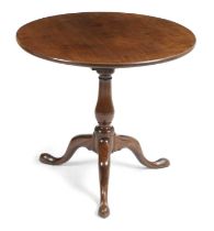 A GEORGE III MAHOGANY TRIPOD TABLE C.1760 the circular tilt top revolving on a birdcage above a