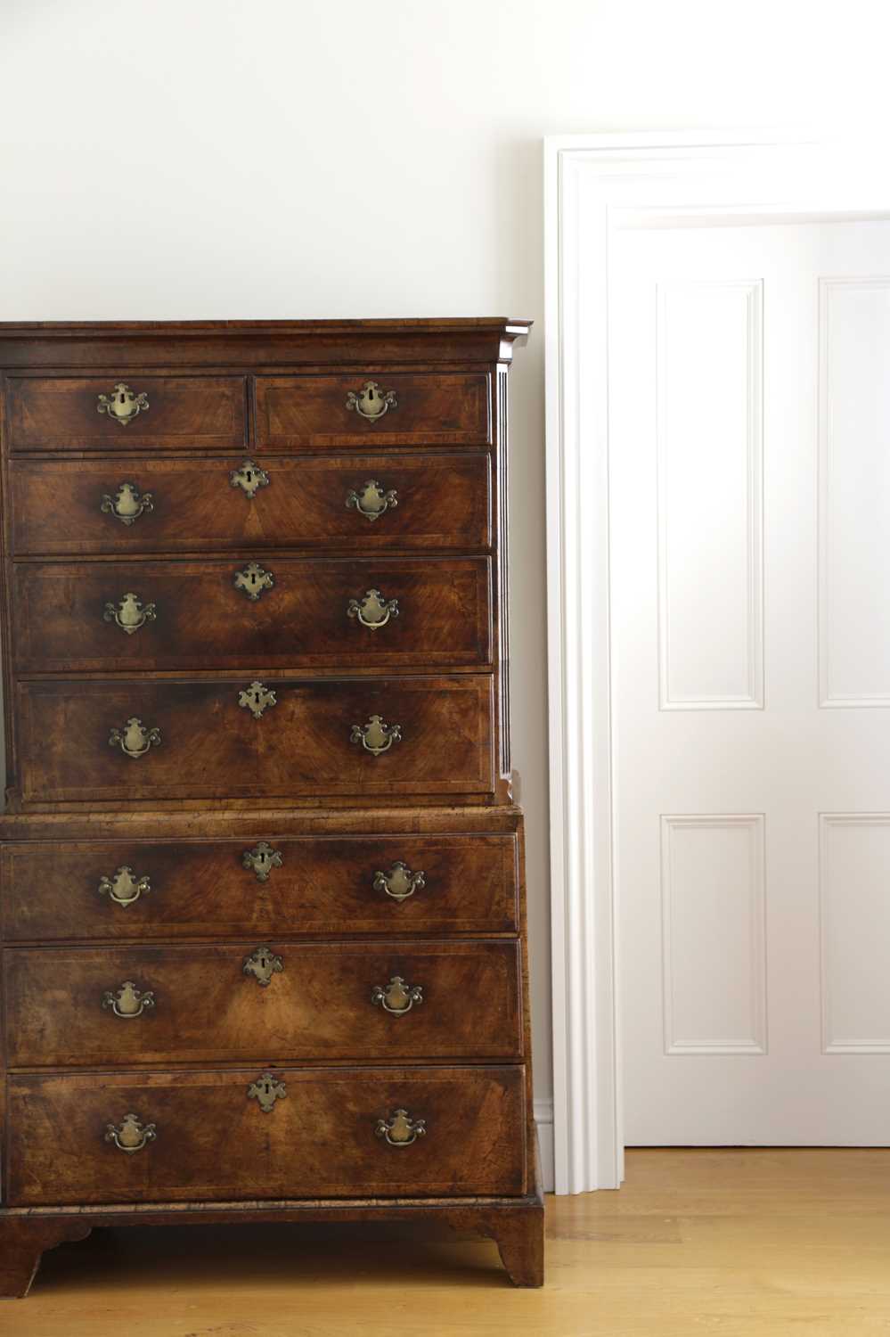 A GEORGE II WALNUT CHEST ON CHEST C.1730 the moulded cornice above two short and three long