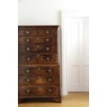 A GEORGE II WALNUT CHEST ON CHEST C.1730 the moulded cornice above two short and three long