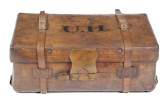 A BROWN LEATHER TRUNK LATE 19TH / EARLY 20TH CENTURY the lid with copper studs revealing a lined
