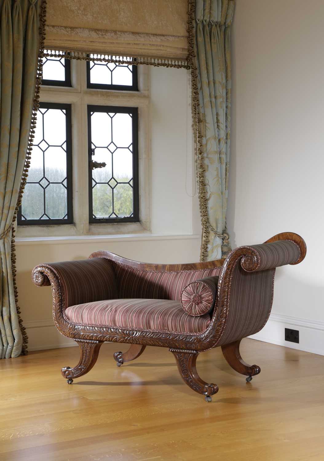 A PAIR OF REGENCY MAHOGANY SOFAS C.1820 the asymetrical scrolling arms with stuffed-over upholstery, - Image 2 of 4