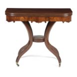 A REGENCY MAHOGANY TEA TABLE EARLY 19TH CENTURY with a reeded edged swivel top above a shaped