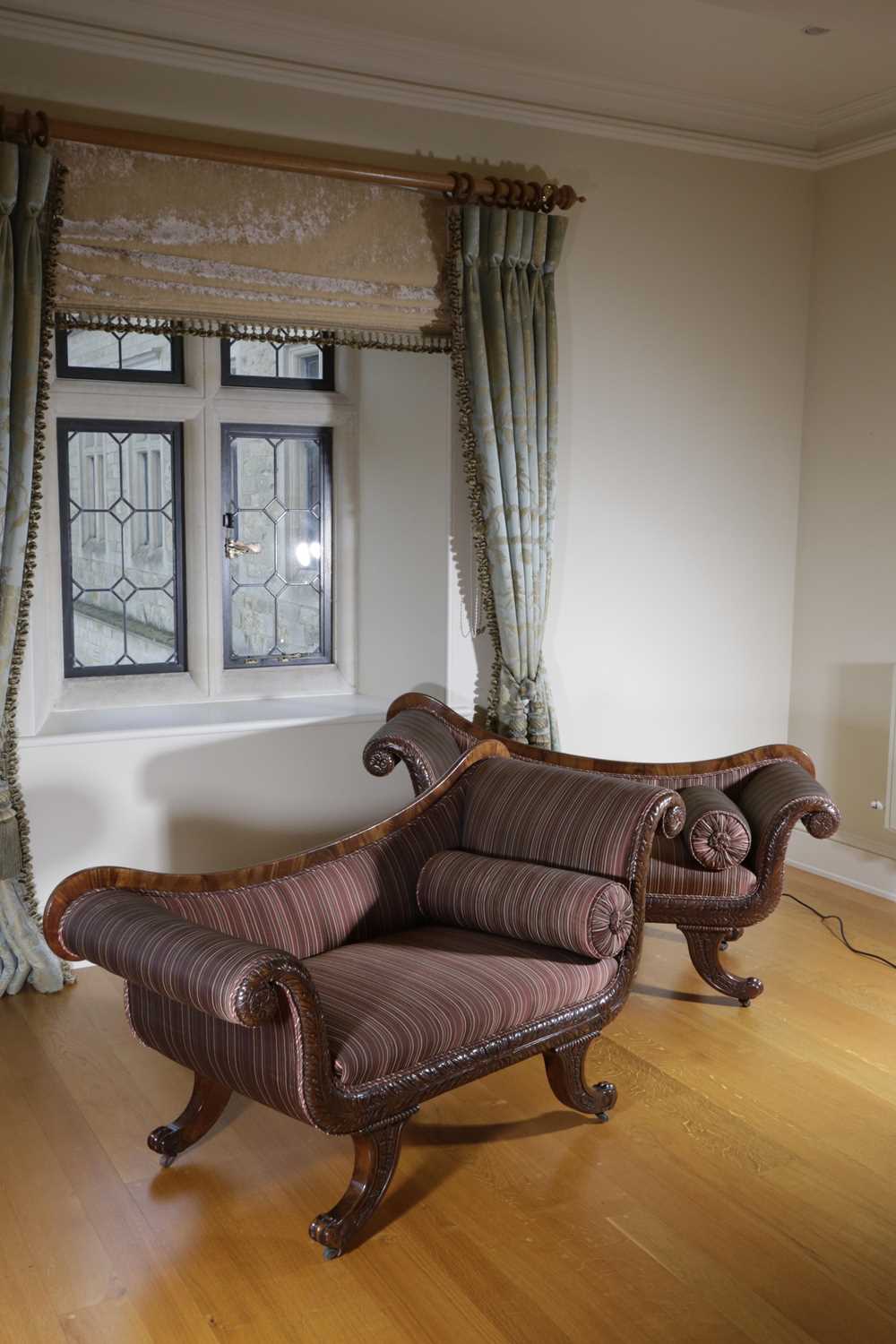 A PAIR OF REGENCY MAHOGANY SOFAS C.1820 the asymetrical scrolling arms with stuffed-over upholstery, - Image 4 of 4
