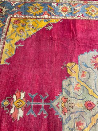 AN USHAK CARPET OF UNUSUAL SIZE CENTRAL WEST ANATOLIA, C.1900 the plain raspberry field centered - Image 8 of 14