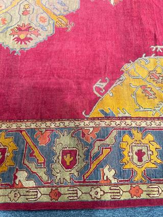 AN USHAK CARPET OF UNUSUAL SIZE CENTRAL WEST ANATOLIA, C.1900 the plain raspberry field centered - Image 13 of 14