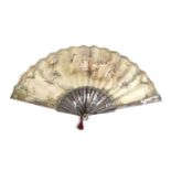 A FRENCH PAINTED AND GILT FAN 19TH CENTURY the leaf decorated with an interior scene of a lady