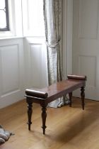 AN EARLY VICTORIAN MAHOGANY HALL BENCH C.1840 the seat with a pair of cylindrical bolsters, on